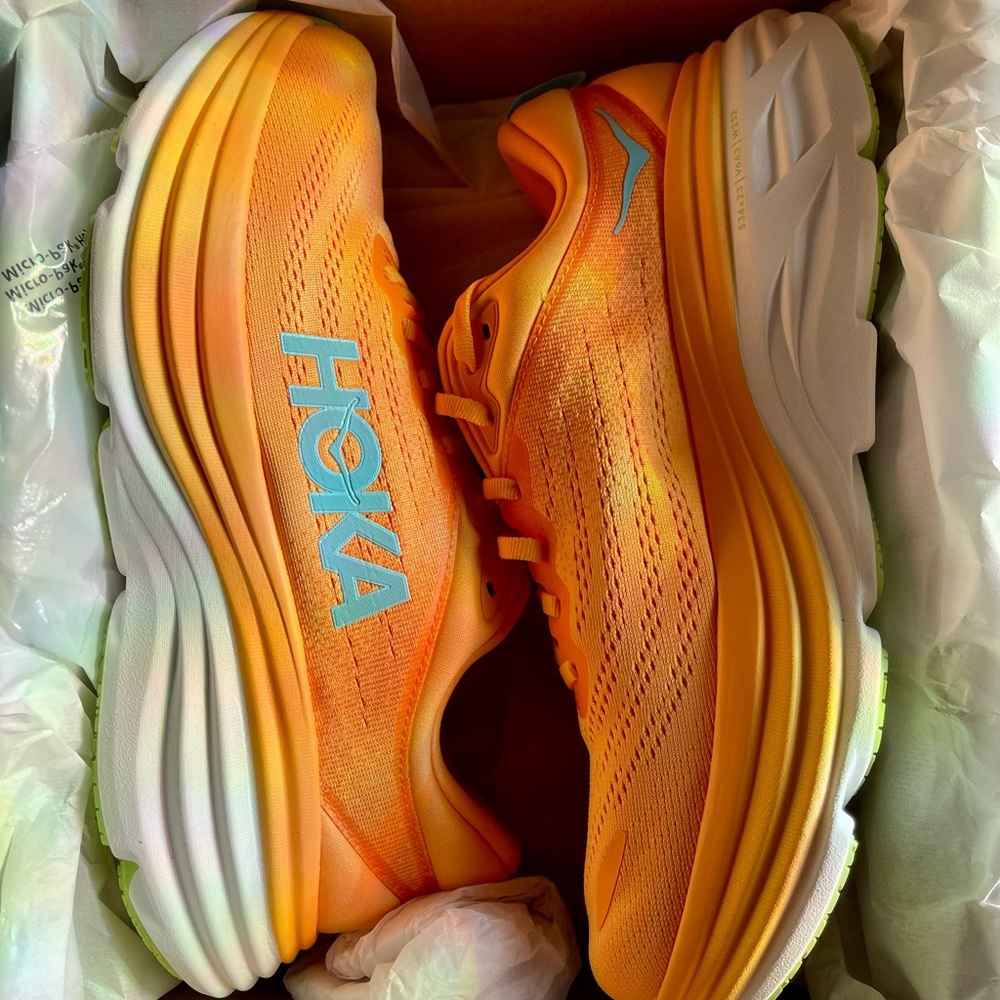 Hoka One One womens vibrant orange and blue sneakers